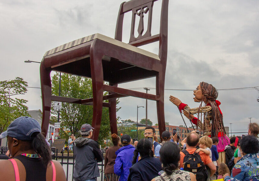 Little Amal at the Big Chair in Anacostia